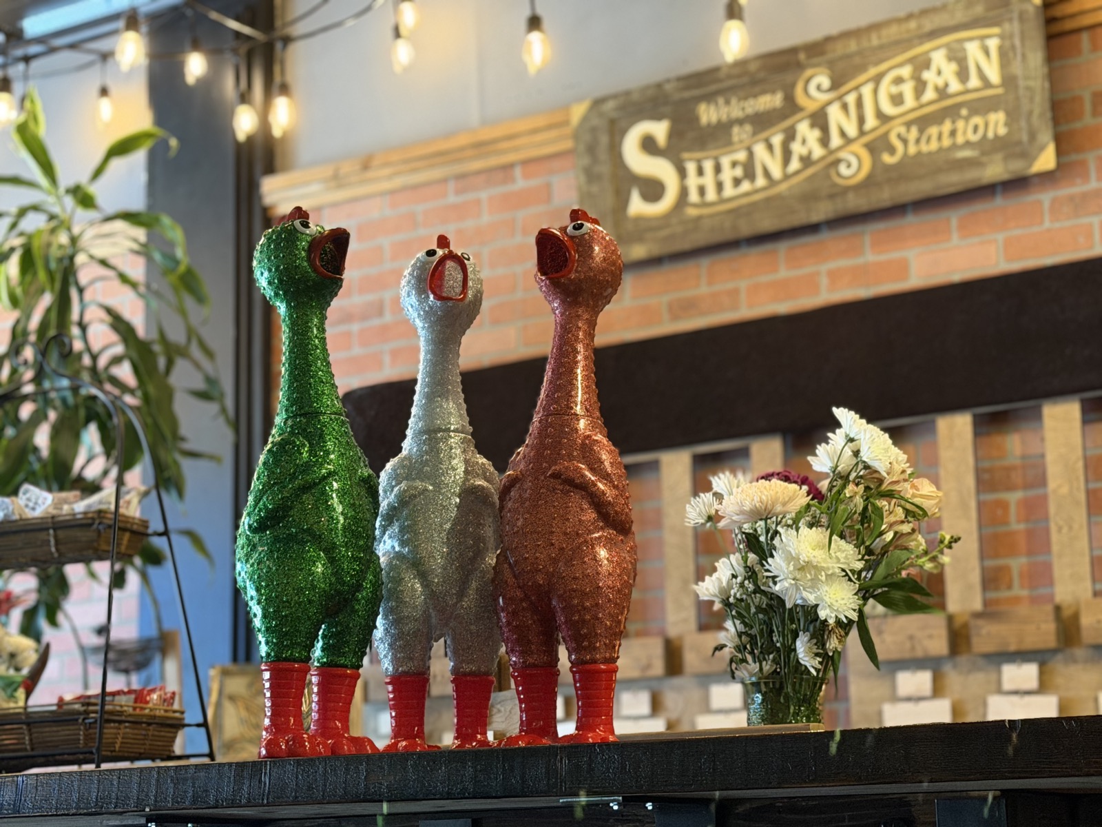 Small singing chicken figures on a shelf